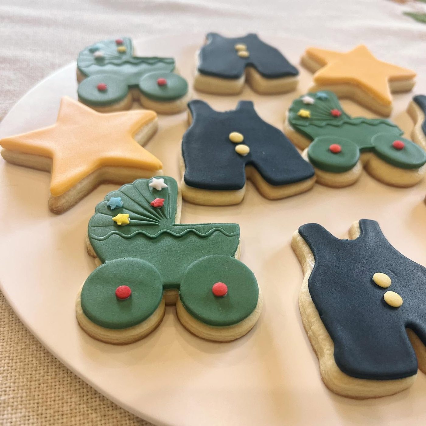 Custom baby shower cookies shaped like a pram and stars